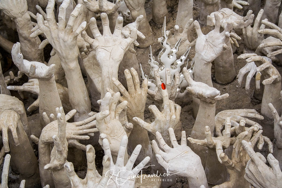 Finger der Höhle Wat Rong Khun